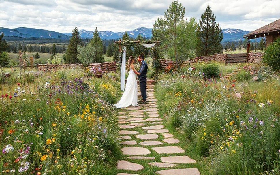 Intimate garden wedding setting with mountain backdrop