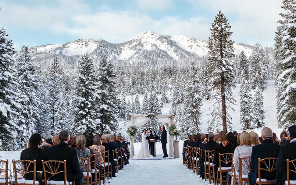 Winter wedding venue with snow-covered pines and mountain views
